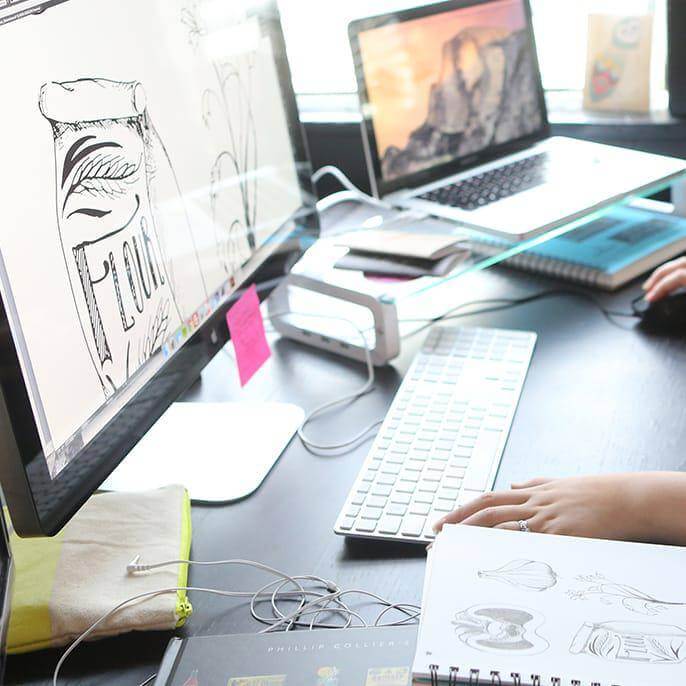 Design and hand-drawn sketches on a computer screen